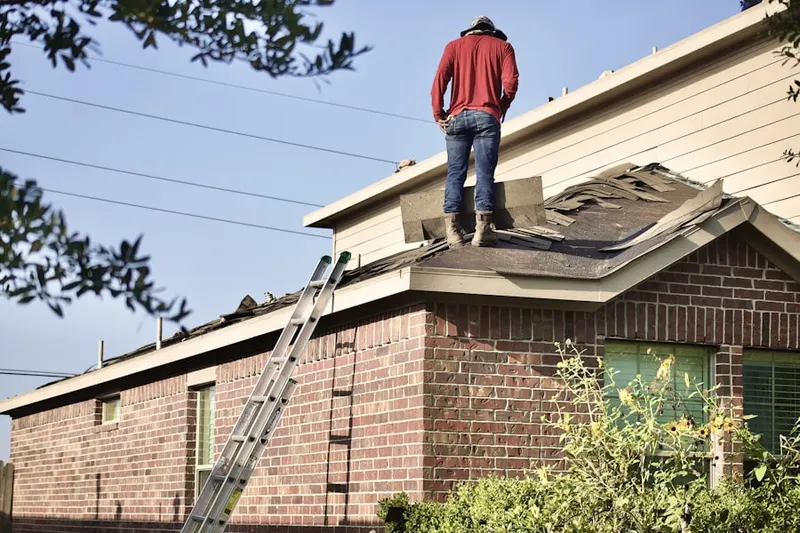 Professional roofer working on a residential roof in Oak Forest